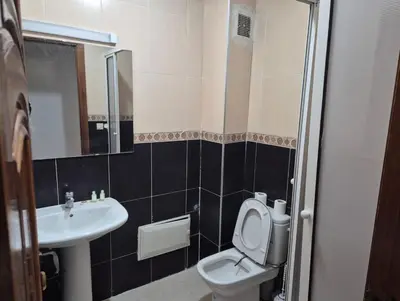 a bathroom with a toilet and a sink at Luxury Apartment in Fes City Centre for Families in Fès