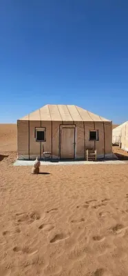 a building in the middle of the desert at Sunlight Desert Camp in Mhamid