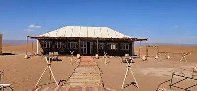 a building in the middle of the desert at Sunlight Desert Camp in Mhamid