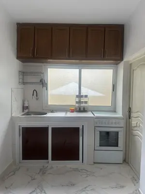 a kitchen with a sink and a window at A unique and cute apartment in a prime location in Er Rachidia