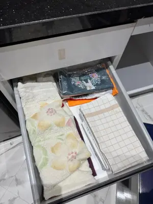 a drawer with two towels on a shelf at Calm Elegant Apartment City Center with Garage in Fès
