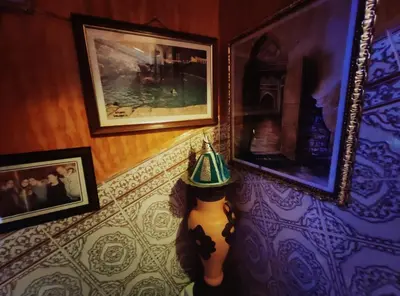 a stuffed animal with a hat on a wall at Kasabah Senhaji in Moulay Idriss Zerhoun