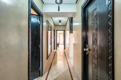 an empty corridor with a door and a hallway at Luxury Suite charming and comfortable in Oulad Akkou