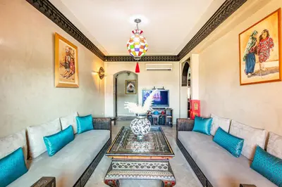 a living room with a couch and a table at Luxury Suite charming and comfortable in Oulad Akkou