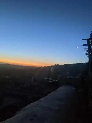 a view from the top of a hill at sunset at Chez Noureddine L 'GARAH in Kermets