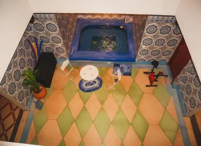 an overhead view of a room with a table and chairs at Dar Atlas, Piscine & Jacuzzi Sans Vis-à-Vis in Sbiti