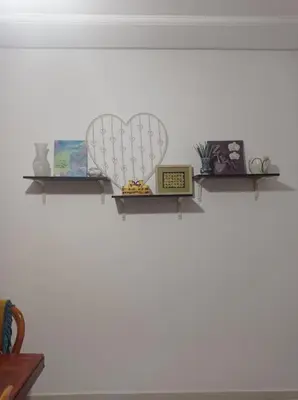 a shelf with a heart and other items on it at appartement neuf au premier etage in Fès