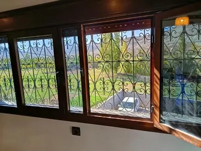 a window with a view of a yard at Auberge Restaurant Camping Taghzout in Agoudal