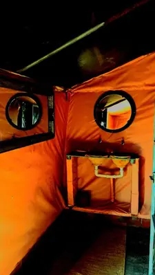 a close up of a tent with two windows at Tigmi Desert Camp in Merzouga