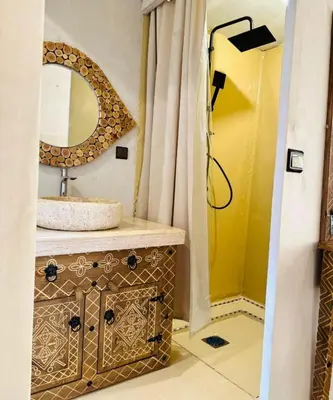 a bathroom with a sink and a mirror at Avatar Luxe Camp in Merzouga