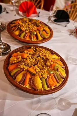 two plates of food sitting on a table at dar d'art Marrakech in Sraïri