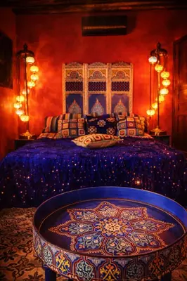 a bedroom with a bed with a blue and red at dar d'art Marrakech in Sraïri
