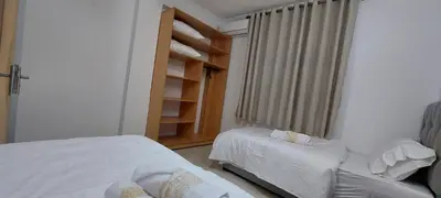 a bedroom with a bed and a chair and a window at Andalucia in Fès