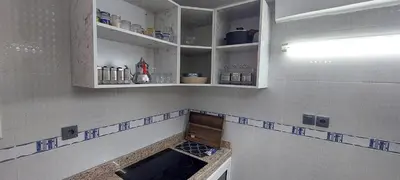 a kitchen with blue and white tiles on the wall at Andalucia in Fès