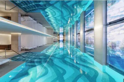 a large swimming pool in a building with a blue ceiling at Cross training CSP TEST in Oulad Akkou