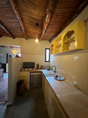 a kitchen with a sink and a counter top at Dar louqman ourika in Asguine