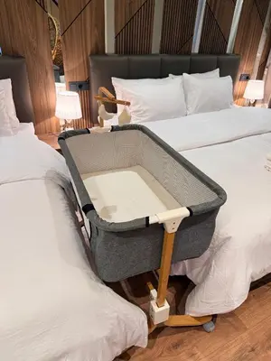 a suitcase sitting on top of two beds at Suite Bahiya 11 in Fès