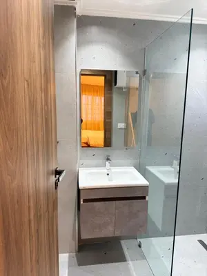 a bathroom with a sink and a mirror at Suite Bahiya 15 in Fès