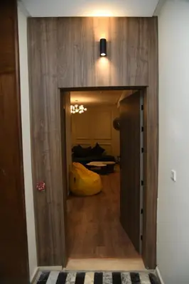a hallway with a door open to a room at Suite Bahiya 15 in Fès