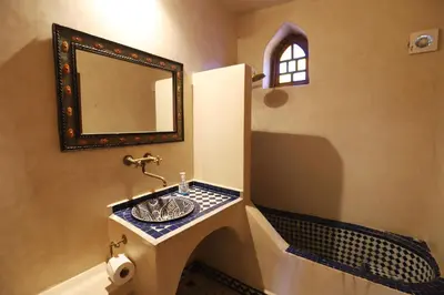 a bathroom with a sink and a mirror at Riad Ruh Fes in Fès