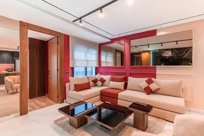 a living room with a couch and a table at Luxury Suite des Princesses in Oulad Akkou