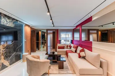 a living room with couches and a table at Luxury Suite des Princesses in Oulad Akkou