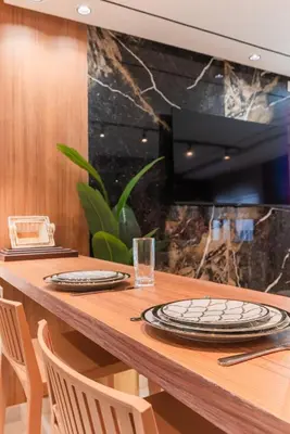 a wooden table with plates on top of it at Luxury Suite des Princesses in Oulad Akkou