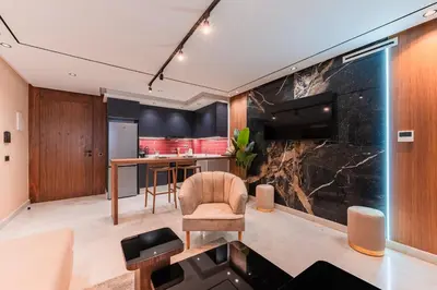 an open living room with a large marble wall at Luxury Suite des Princesses in Oulad Akkou