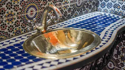 a bathroom sink with a faucet on a counter at Villa Nafsi Aghmat Marrakech Piscine Chauffée in Aït Namous