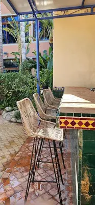 two chairs and a table on a patio at Villa Nafsi Aghmat Marrakech Piscine Chauffée in Aït Namous