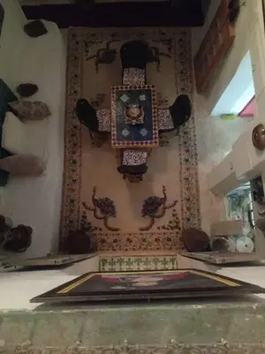 a clock on the wall of a room at IVANKA Guest House in Fès