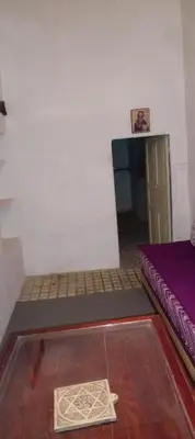 a small room with a bed and a door at IVANKA Guest House in Fès