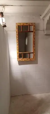 a mirror on the wall of a bathroom at IVANKA Guest House in Fès