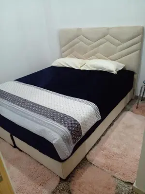 a bed sitting in a room with a mattress at Casa Miriam fes in Fès