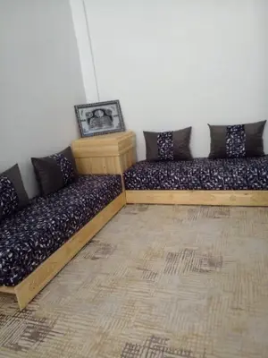 two wooden futon beds in a room at Casa Miriam fes in Fès