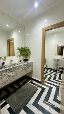 a bathroom with a large mirror and a sink at Exceptional Marrakech Villa 5 Bedrooms & Pool in Oulad Akkou