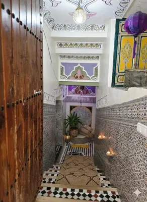a hallway of a mosque with a tile floor and a ceiling at Riad Dalia - Fes Medina in Fès