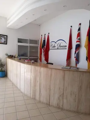 a counter in a restaurant with flags on it at BEST DREAM Spot in Oulad Akkou