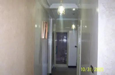 a hallway with a room with a door and a mirror at séjour à MARRAKECH in Oulad Akkou
