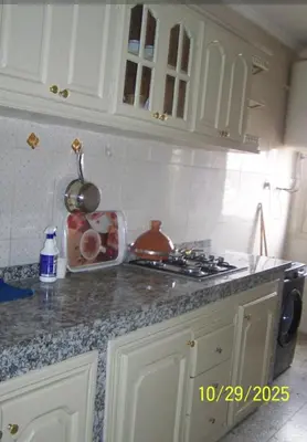 a kitchen with a stove and a counter top at séjour à MARRAKECH in Oulad Akkou