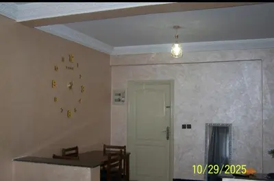 a room with a ceiling with a door and a table at séjour à MARRAKECH in Oulad Akkou
