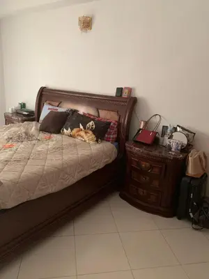 a cat laying on a bed in a bedroom at Tessas Crib in Fès