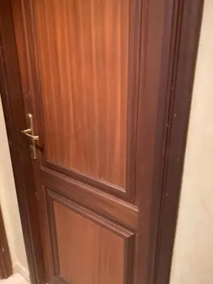 a wooden door with a glass panel on it at Tessas Crib in Fès