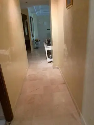 a hallway with a tile floor in a house at Tessas Crib in Fès