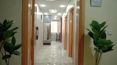 a hallway with doors and potted plants in a room at APPARTEMENT AMJAD iFRANE in Ifrane