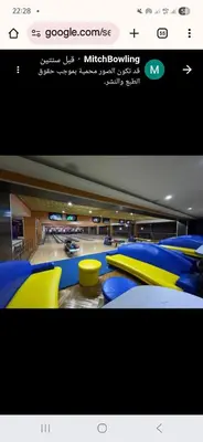 a picture of a gym with blue and yellow beds at APPARTEMENT AMJAD iFRANE in Ifrane