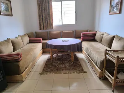 a living room with a couch and a table at Le séjour agréable in Ifrane