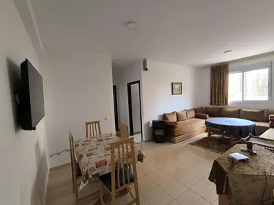 a living room with a couch and a table at Le séjour agréable in Ifrane