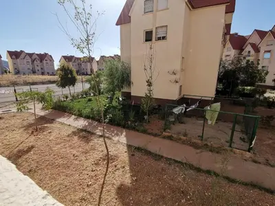 a garden in front of a house at Le séjour agréable in Ifrane