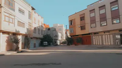 an empty street in an alley between buildings at appartement chic, calme et bien équipé in Meknès